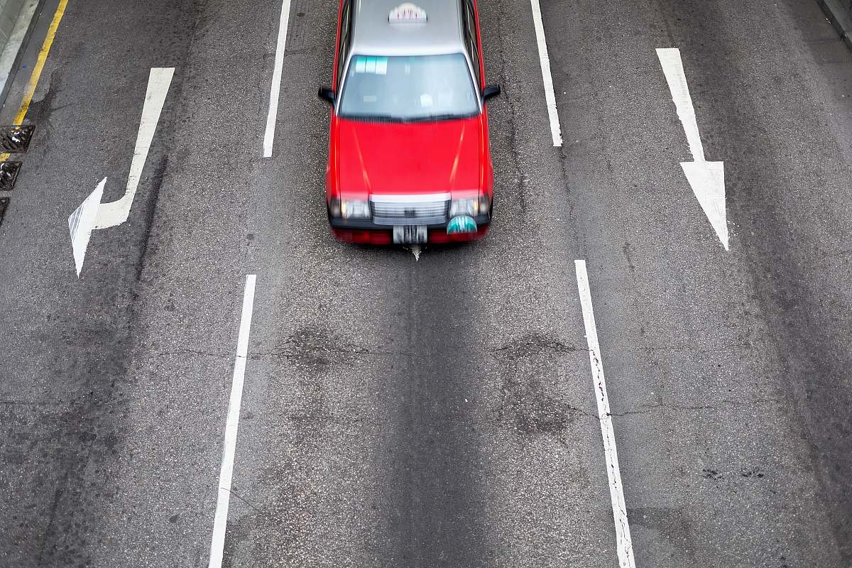 hong kong car traversing road at daytime vehicle